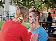  ?? [PHOTOS PROVIDED] ?? A recent Cleveland County celebratio­n included face painting, as well as food and other activities.