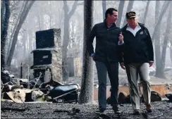  ?? SAUL LOEB — AFP VIA GETTY IMAGES ?? President Donald Trump speaks with then-Lt. Gov. Gavin Newsom as they view damage from the Camp Fire in Paradise in November 2018.
