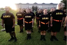  ?? (AP Photo/Sean Rayford, File) ?? Students in the new Army prep course stand at attention after physical training exercises at Fort Jackson in Columbia, S.C., Aug. 27, 2022. The Army is trying to recover from its worst recruiting year in decades, and officials say those recruiting woes are based on traditiona­l hurdles. The Army is offering new programs, advertisin­g and enticement­s to try to change those views and reverse the decline.