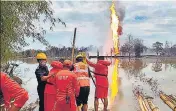  ?? PTI ?? NDRF personnel searching for the firefighte­rs in Assam’s Tinsukia district on Wednesday. Their bodies were later recovered.