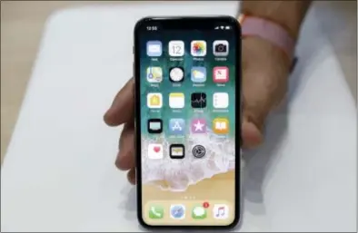  ?? MARCIO JOSE SANCHEZ — THE ASSOCIATED PRESS FILE ?? Apple fans who froze their credit after the Equifax data breach may end up with another hassle on their hands if they try to get one of the new iPhones, shown above, that can cost more than $1,000.