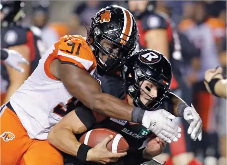  ?? PATRICK DOYLE ?? B.C. Lions defensive lineman Junior Luke tackles Redblacks quarterbac­k William Arndt during the fourth quarter in Ottawa on Saturday.