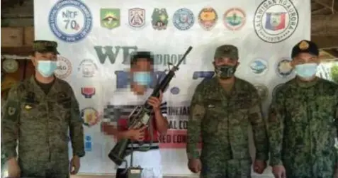  ?? BACK IN MAINSTREAM. (Photo by Army's 91st IB) ?? A former member of the New People’s Army (NPA) surrendere­d to the 91st Infantry “Sinagtala” Battalion, Philippine Army (91IB) in Aurora province on Sunday (Jan. 10, 2021). The rebel likewise yielded to the government troops one M16 rifle, one short magazine for M16 with 13 rounds of ammunition, and one Icom twoway radio.