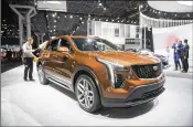  ?? MICHAEL NOBLE JR. / BLOOMBERG ?? The new XT4, geared to appeal to younger buyers, starts at around $35,000 and goes close to $50,000 with options.