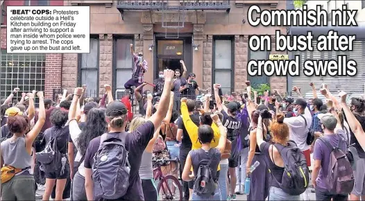  ??  ?? ‘BEAT’ COPS: Protesters celebrate outside a Hell’s Kitchen building on Friday after arriving to support a man inside whom police were trying to arrest. The cops gave up on the bust and left.