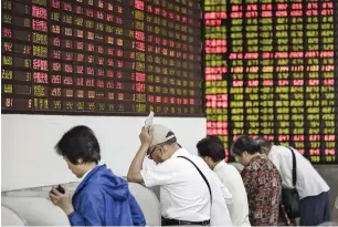  ?? — Bloomberg ?? Chinese stocks led the losses, with the Shanghai Composite index plumbing a 20-month low.