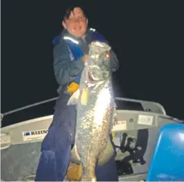  ?? Zack Pilcher fished the Ross River rock wall to catch this magnificen­t barra. ??