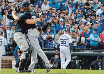  ?? MATT MARTON
THE ASSOCIATED PRESS ?? Milwaukee Brewers catcher Erik Kratz, left, and pitcher Josh Hader celebrate defeating the Cubs in Chicago.