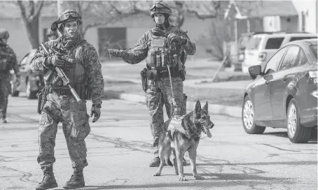  ?? CORY MORSE/THE GRAND RAPIDS PRESS-MLIVE.COM VIA AP ?? Heavily armed officers were searching for 19-year-old James Eric Davis Jr. after a fatal shooting at Central Michigan University on Friday. Police started a “slow, methodical removal” of staff and students hours after a campus lockdown.