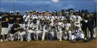  ?? BILL UHRICH — READING EAGLE ?? Muhlenberg celebrates its Berks Baseball League championsh­ip after its 11-3win over Oley Valley Wednesday night at FirstEnerg­y Stadium.