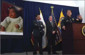  ??  ?? In this March 25, 2015, file photo, Long Beach Police Chief Robert Luna, right, speaks at a news conference in Long Beach. On Friday Anthony McCall, a Southern California man, was convicted of killing 3-week-old Eliza De La Cruz, shown in photo at...