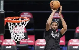  ?? KATHY WILLENS — THE ASSOCIATED PRESS ?? Brooklyn’ Kevin Durant shoots during pregame warmups before Sunday’s preseason game against Washington in New York.