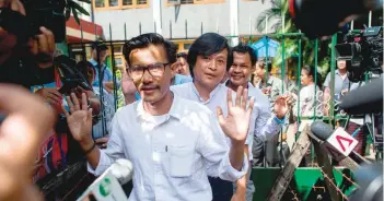  ?? — AFP ?? This file photo taken on October 26 shows detained Myanmar journalist­s Kyaw Zaw Linn (L) followed by Nayi Min (C) and Phyo Wai Win (R) leaving the court compound after a hearing in Yangon.