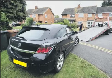  ??  ?? ON TOW: The Vauxhall Astra is confiscate­d after its owner allegedly failed to pay 13 parking fines