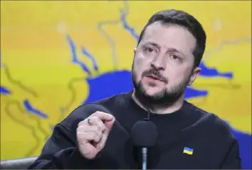  ?? Efrem Lukatsky/Associated Press ?? In Ukraine, presidenti­al elections are set to be held in late March, but the ongoing emergency imposed by Russia’s invasion may prompt President Volodymyr Zelenskyy to postpone them.