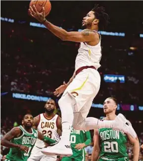  ?? AFP PIC ?? Cleveland Cavaliers’ Derrick Rose drives to the basket past Boston Celtics’ Gordon Hayward (right) in their NBA match at Quicken Loans Arena in Cleveland, Ohio on Tueday.