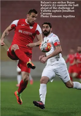  ??  ?? Balzan's ace striker Bojan Kaljevic (L) controls the ball ahead of the challenge of Valletta captain Jonathan Caruana Photo: Domenic Aquilina