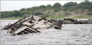  ?? The Associated Press ?? The wreckage of a World War II German warship is seen in the Danube river in Serbia.