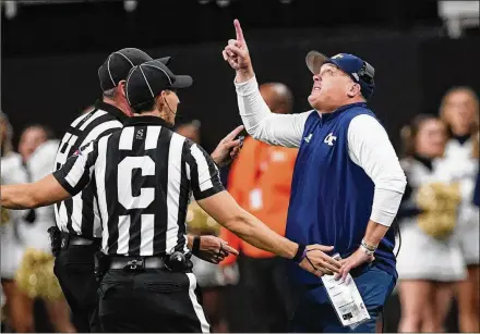  ?? JOHN BAZEMORE/ASSOCIATED PRESS ?? Georgia Tech head coach Geoff Collins points to the video board as he argues with officials Sept. 25 in a game against North Carolina in Atlanta. The Jackets’ best chance to advance upon the totals from the past two seasons is Saturday.