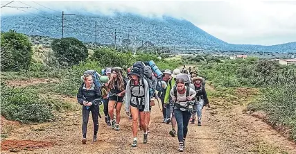  ?? Picture: SUPPLIED ?? LONG TREK: With a railway line to their right and having just passed a settlement on their left, this fully-laden group of Diocesan School for Girls and St Andrew’s College grade 10 pupils tackle an uphill hike over the weekend on one of the stages of the 21-day Fish River Journey from Graaff-Reinet to the Fish River mouth. Read the story on this page.