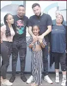  ?? ?? Tammy Dlamini and family (2ndL) pictured with Kiernan Jarryd Forbes, known to many as AKA or Super Mega (2ndR) in this undated photo.