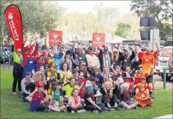  ??  ?? KIDS FOR KIDS: Participan­ts in a Variety Brats Bash tour of western Victoria gather in their team colours at Warracknab­eal as part of their seven-day, 1500-kilometre trip to raise money for families and children. Picture: RACHEL DECKERT