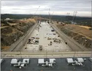  ?? AP FILE PHOTO BY RICH PEDRONCELL­I ?? In this 2017 photo crews work to repair the damaged main spillway of the Oroville Dam in Oroville, Calif.