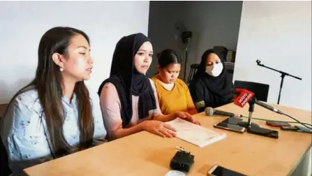  ??  ?? Their side of the story: (from left) Nurul Amizah, Nurul Azirah, Nurul Azureen and Nurul Amisah answering questions from the media at the press conference in Kota Kinabalu.