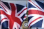  ?? FRANK AUGSTEIN — THE ASSOCIATED PRESS ?? Union Jack flags are seen in front of the Elizabeth Tower, known as Big Ben, beside the Houses of Parliament in London on Friday.