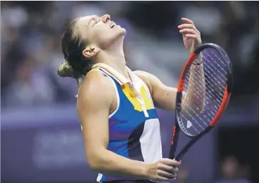  ?? Clive Brunskill Getty Images ?? AN UNUSUALLY DIFFICULT first-round draw worked out badly for No. 2-seeded Simona Halep, who was upset by Maria Sharapova, a five-time major winner who rejoined the tour in April after a doping suspension.