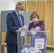  ?? (AFP) ?? Turkish-Cypriot President Mustafa Akinci and his wife Meral Akinci cast their ballots at a polling station, in Nicosia on Sunday