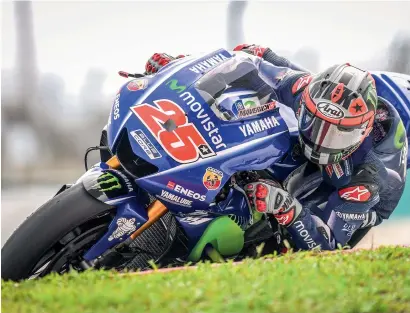 ?? — AFP ?? Movistar Yamaha MotoGP’s Spanish rider Maverick Vinales takes a corner during the last day of 2017 MotoGP pre-season test.