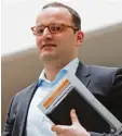  ?? Foto: dpa ?? Jens Spahn muss Kritik für eine Firmen beteiligun­g einstecken.