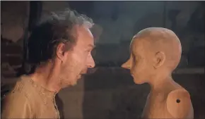  ?? Greta De Lazzaris / Associated Press ?? Roberto Benigni, left, and Federico Ielapi in a scene from “Pinocchio.”