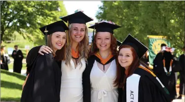  ?? ?? From left, Olivia Keane of Hamilton, Sara Lortie of Fitchburg, Kelli Lowthers of Ashby and Olivia Lepore of Lancaster, all receiving a bachelor’s degree in nursing, wait for the start of Fitchburg State University’s Commenceme­nt on Saturday.