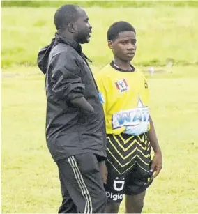  ?? (Photo: Paul Reid) ?? Black River High Coach Vayden Hayle (left) converses with player Jamien Williams during their dacosta Cup Zone D game against Manning’s School in Savanna-la-mar on Tuesday.