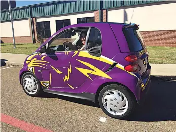  ?? Submitted photo ?? ■ Ashdown School Resource Officer Stephanie Boyer cruises in the “smart patrol car” on the campus of an Ashdown school. The county received a $12,000 grant to purchase the Smart car and convert it to a patrol car. The vehicle has a growl to go along with a siren since it represents the mascot of the Ashdown Panthers.