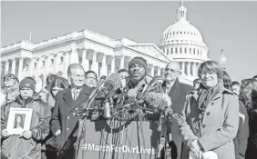  ?? J. SCOTT APPLEWHITE/AP ?? Robert Edwards, center, a student from Washington, rallies with lawmakers and supporters on the eve of Saturday’s march in the capital.