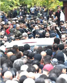  ?? — AFP photos ?? Guests of mourning gather at the funeral of shot multiple offender Nidal Rabih at the New Twelve Apostle Churchyard in Berlin.