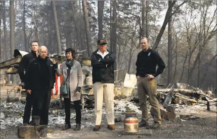  ?? Evan Vucci / Associated Press file photo ?? President Donald Trump in November talks with from left, Gov.-elect Gavin Newsom, California Gov. Jerry Brown, Paradise Mayor Jody Jones and FEMA Administra­tor Brock Long during a visit to a neighborho­od destroyed by the wildfires in Paradise, Calif. Trump is threatenin­g to withhold Federal Emergency Management Agency money to help California cope with wildfires if the state doesn't improve its forest management practices.