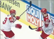  ?? PETR DAVID JOSEK — THE ASSOCIATED PRESS ?? Denmark’s Nichlas Hardt, left, celebrates with Mikkel Boedker after scoring Wednesday in the win over Finland.