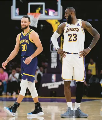  ?? ASHLEY LANDIS/AP ?? Stephen Curry is set to make his Olympic debut and LeBron James will play in his fourth Games when Team USA competes for its fifth straight gold medal at this summer’s Paris Olympics. The 12-man U.S. roster was revealed Wednesday.