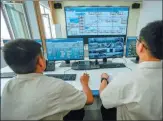  ?? PHOTOS BY ZHAO GE / XINHUA ?? Counterclo­ckwise from top: A maintenanc­e engineer at a water plant in Jiashi checks purificati­on equipment. Two staff members view the real- time status of machinery at the facility. Employees check tanks of clean water at the plant.