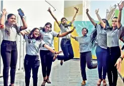  ?? R. PAVAN ?? Girl students of Resonance College at Madhapur celebrate their passing the Inter exams after the results were announced on Wednesday. — .
