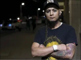  ?? AP PHOTO/ MOISES CASTILLO ?? In this Nov. 1, photo, Honduran migrant Braulio Bustillo, 33, poses for photo as he waits for a bus at the Metropolit­an Grand Central bus terminal in San Pedro Sula, Honduras.