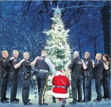  ?? — ABBOTSFORD POLICE DEPARTMENT ?? A Christmas card from the Abbotsford Police Department is shown in a handout photo. Police have taken a different approach to its annual Christmas card, using the opportunit­y to say thank you in honour of fallen comrade Const. John Davidson who was...