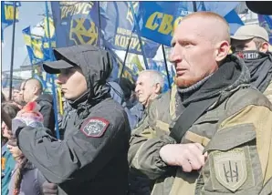  ?? Efrem Lukatsky Associated Press ?? ULTRA-rightists rally in Kiev. Illiberal nationalis­m is surging through Eastern Europe.