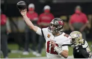  ?? BRYNN ANDERSON — THE ASSOCIATED PRESS ?? Buccaneers quarterbac­k Tom Brady (12) passes against the Saints during the first half Jan. 17in New Orleans.