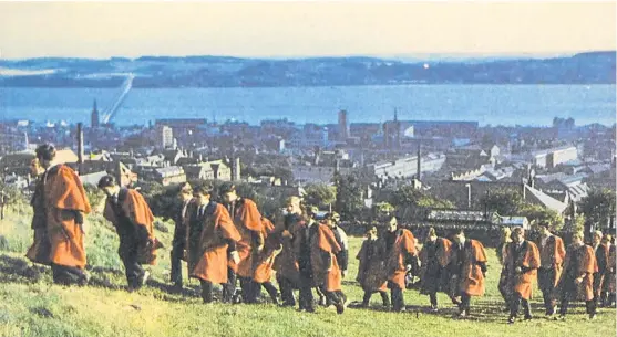  ??  ?? Dundee University students climb the Law in 1967. See more on left.