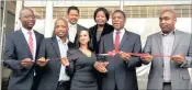  ??  ?? RIBBON CUTTING: Gauteng Property Fund boss Boni Muvevi, left, GPF chair Paike Mphahlele, Rose Valloo of Trust for Urban Housing Finance, Siyabonga Mbanjwa, back, left, and Lavinia Khangala.